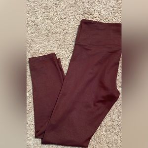 Women’s ZYIA 7/8 length tights. NWOT burgundy color size 6-8